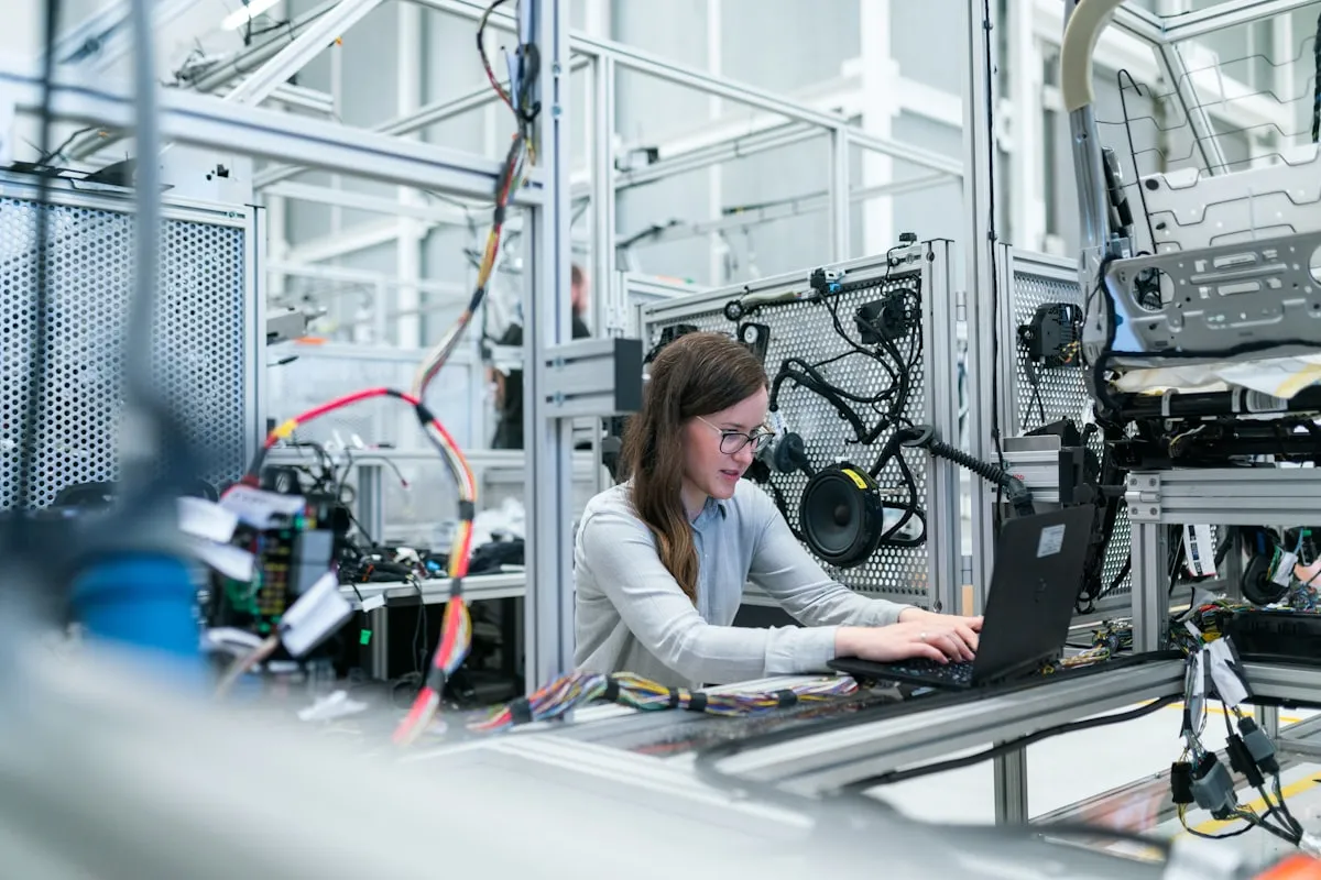 An engineer running an automated production line — work handed to a system