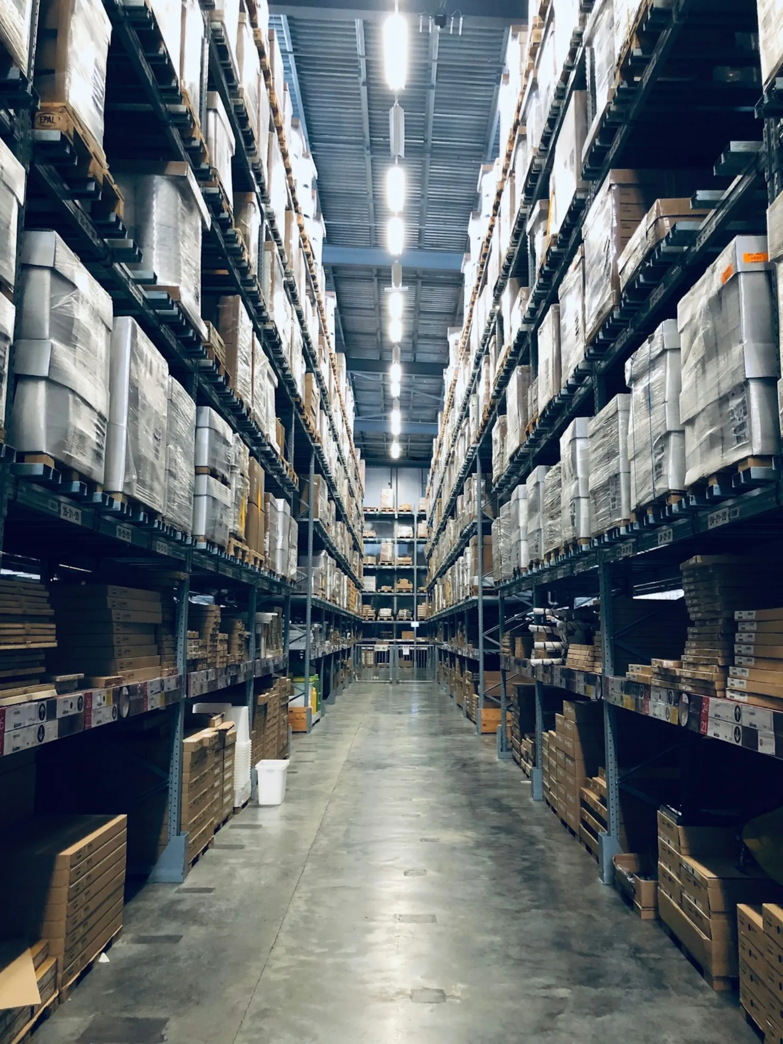 A warehouse aisle — the operation a custom system has to keep in step